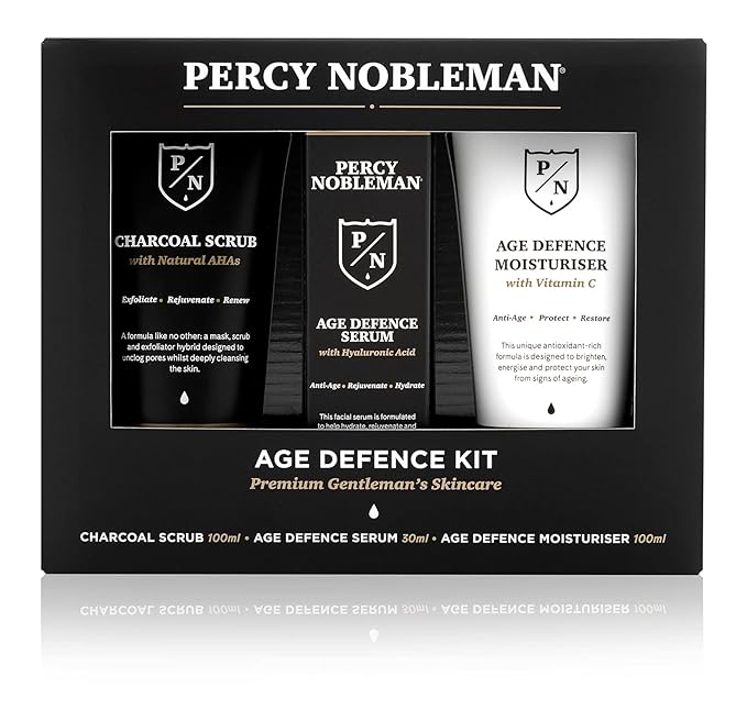 Percy Nobleman Age Defence Kit, a men's skincare set containing Charcoal Face Scrub (with Natural AHAs), ultra-hydrating Facial Serum (with Hyaluronic Acid), and Moisturiser (with Vitamin C)