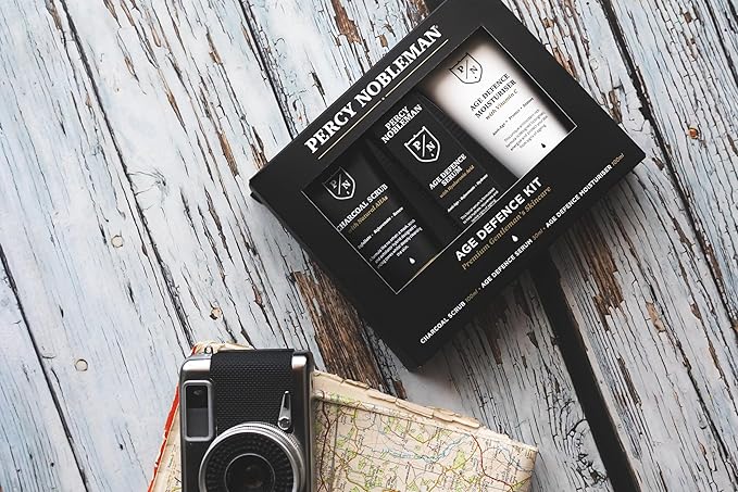 Percy Nobleman Age Defence Kit, a men's skincare set containing Charcoal Face Scrub (with Natural AHAs), ultra-hydrating Facial Serum (with Hyaluronic Acid), and Moisturiser (with Vitamin C)